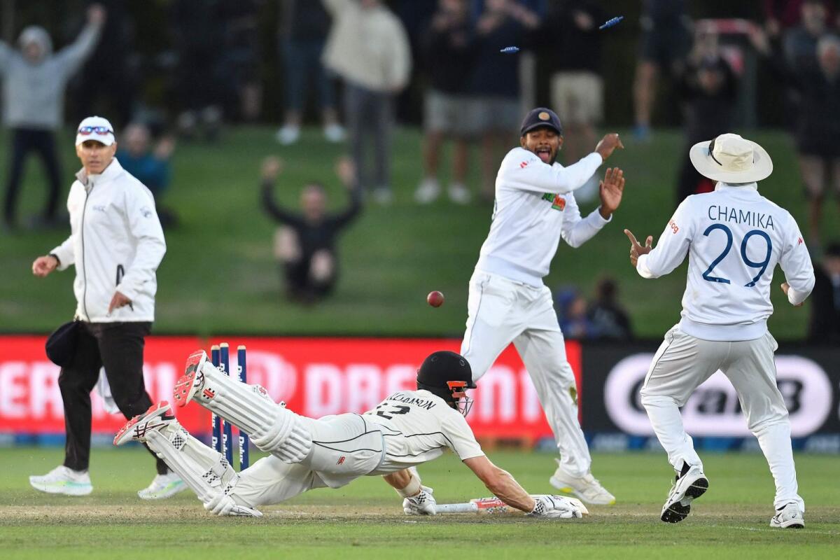New Zealand's Kane Williamson (centre) makes a successful run to win the first Test match against Sri Lanka at Hagley Oval in Christchurch. — AFP