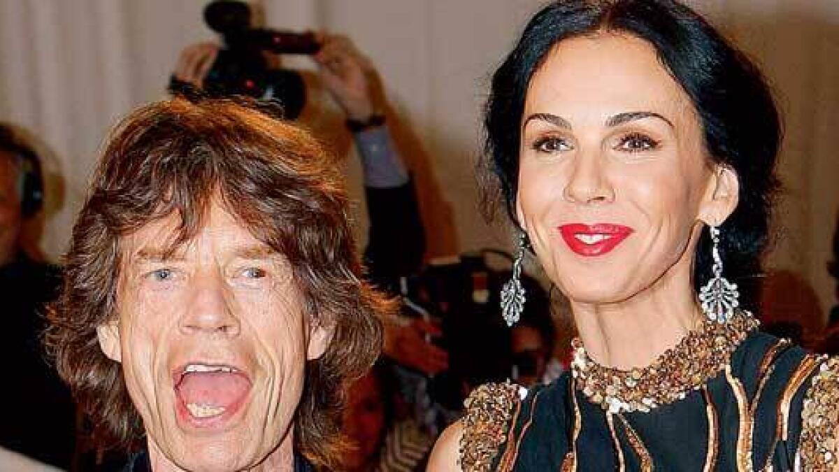 Jagger pays tribute to companion as Stones halt tour