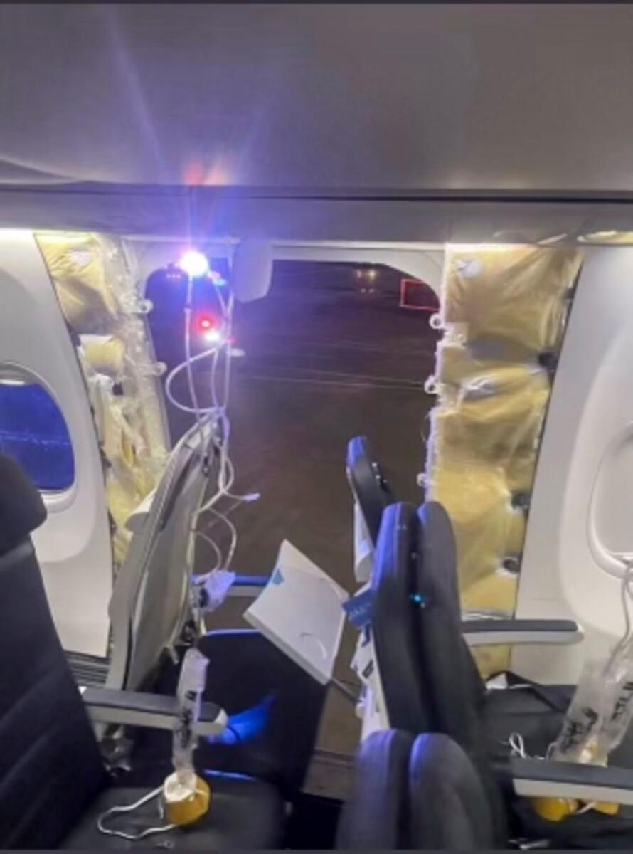 This photo provided by an unnamed source shows the damaged part of an Alaska Airlines Boeing 737 Max 9, Flight 1282, which was forced to return to Portland International Airport on Friday. — AP