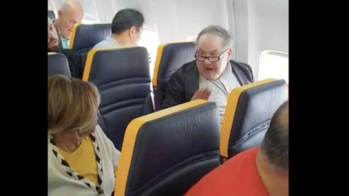 Video: Man yells racist slurs at woman on plane