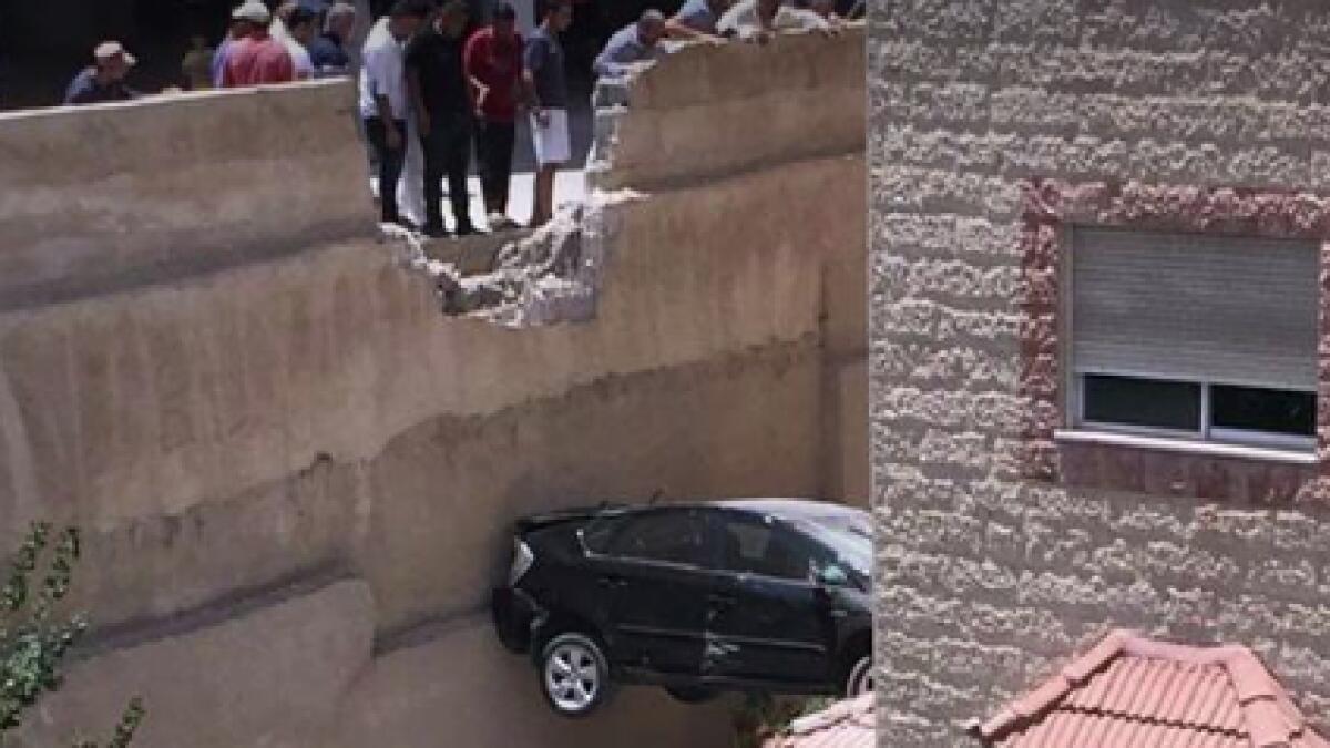 Photos: Car stuck mid-air between two buildings in Jordan