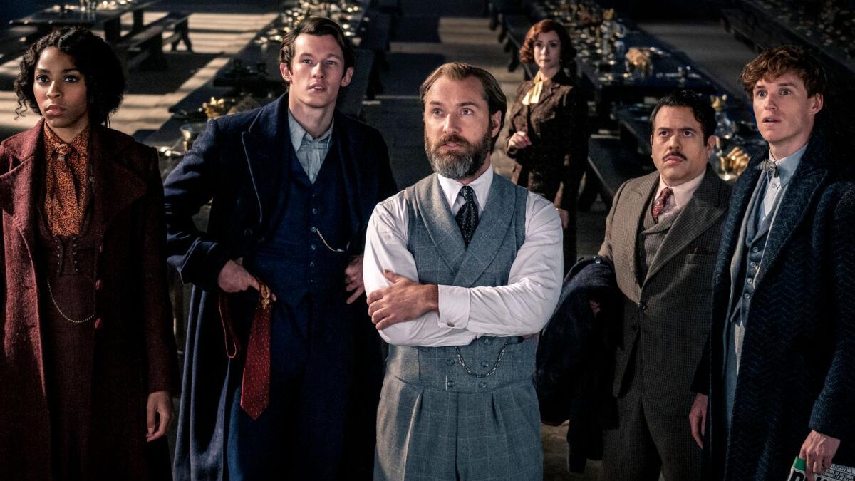 Jessica Williams, Callum Turner, Jude Law, Fionna Glascott, Dan Fogler and Eddie Redmayne in a scene from 'Fantastic Beasts: The Secrets of Dumbledore'.