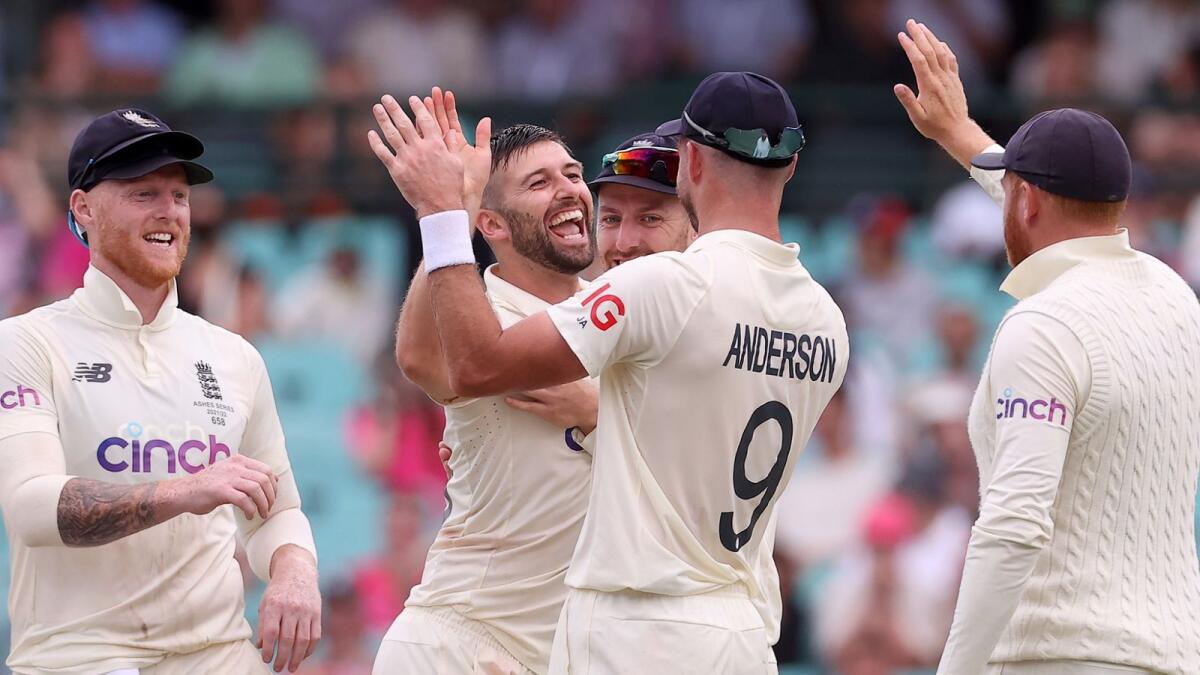 England's Mark Wood (second from left) celebrates with his teammates after dismissing Australia's Marnus Labuschagne on Wednesday. — AFP