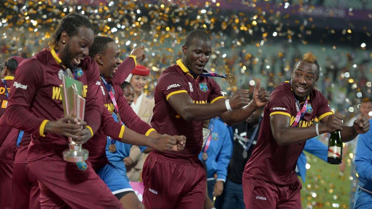 West Indies's cricketers celebrate after winning the World T20 cricket tournament final match between England and West Indies at The Eden Gardens Cricket Stadium in Kolkata on April 3, 2016.
