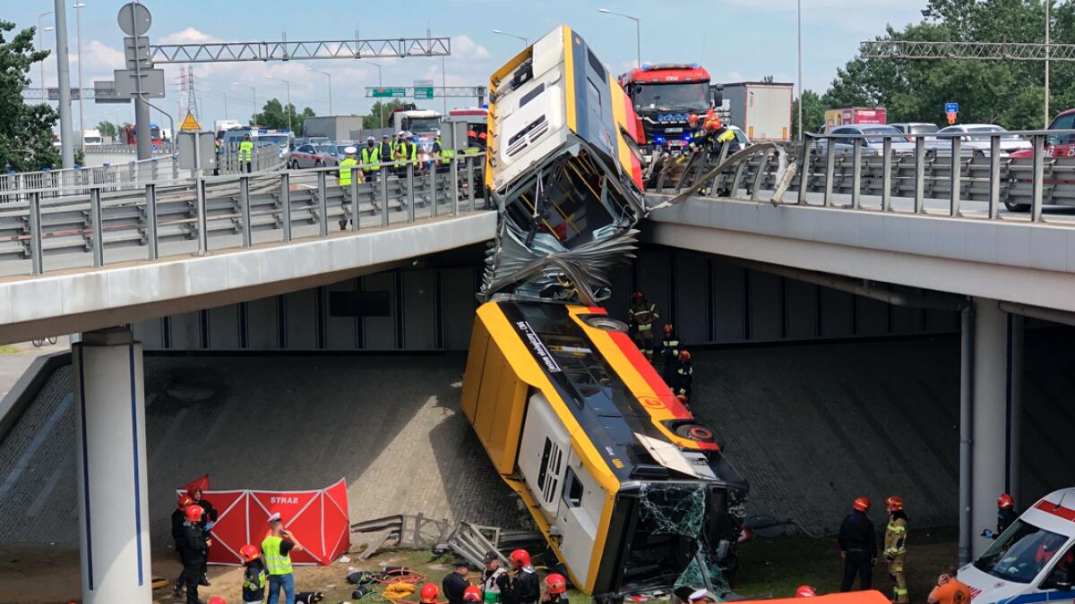 A view of Warsaw city bus after it crashed off an overpass, in Warsaw, Poland. Photo: AP
