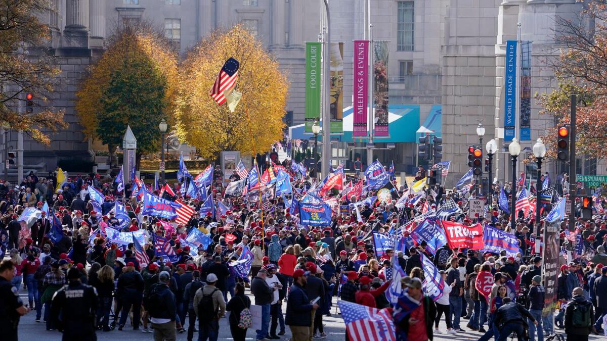 Supporters of President Donald Trump attend pro-Trump marches, Saturday Nov. 14, 2020, in Washington. (AP Photo/Jacquelyn Martin)