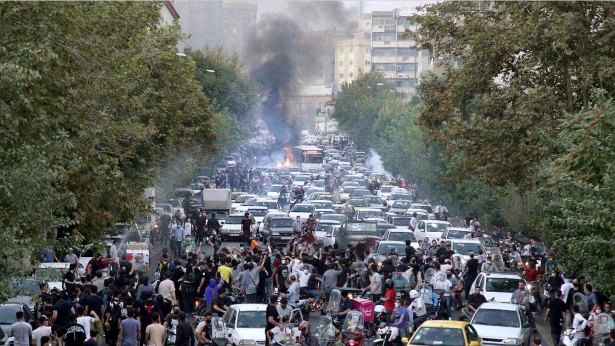 Protests in Downtown Tehran over the death of 22-year-old Mahsa Amini, who was detained by Iran's morality police. — AP