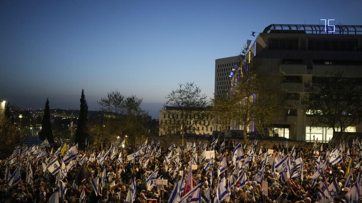 People take part in a protest against the Israeli government and call for the release of hostages held in the Gaza Strip by the Hamas militant group outside of the Knesset, Israel's parliament, in Jerusalem. — AP