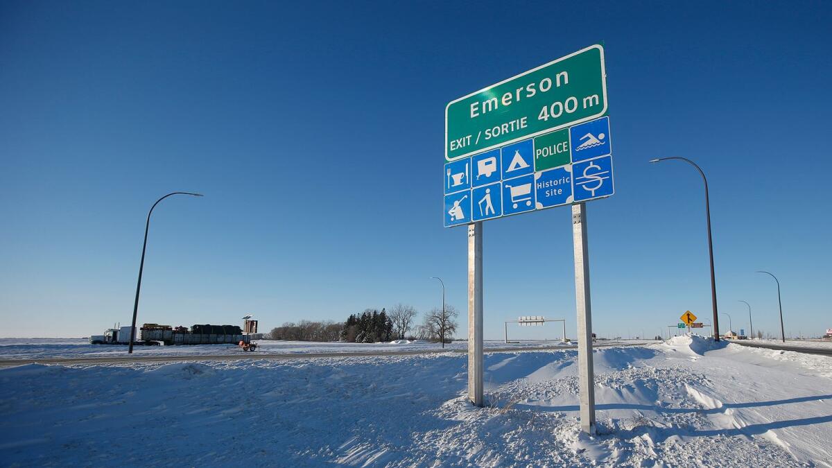 Road signage posted just outside of Emerson, Manitoba. The bodies of four people, including a baby and a teen, were found in Canada near the US border. – AP