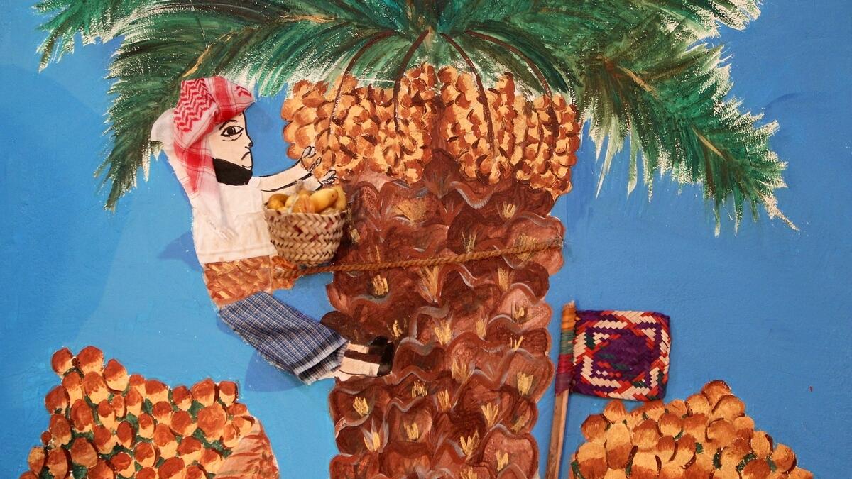 ART OF THE MATTER... A painting on the favourite fruit.  Original dates and date palm products are used  to add colour to it. (M. Sajjad)
