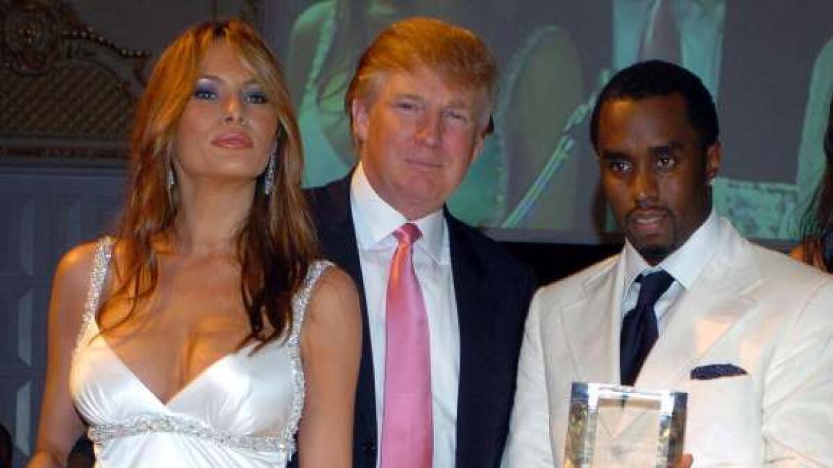 In March, 2005 Donald and Melania are on hand when Sean 'P. Diddy' Combs, right, accepts an award from the Rush Philanthropic Foundation for his efforts to support public education and dedication to youth and social activism.