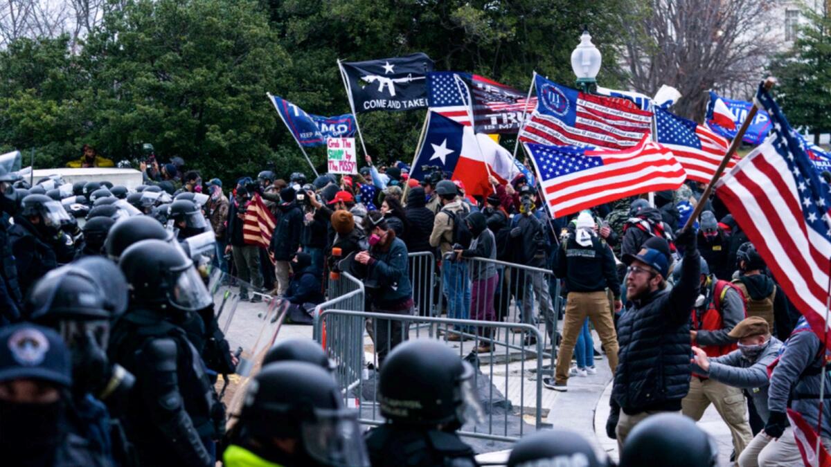 In this Jan. 6, 2021, file photo insurrections loyal to President Donald Trump confront U.S. Capitol Police officers outside the Capitol in Washington. — AP file