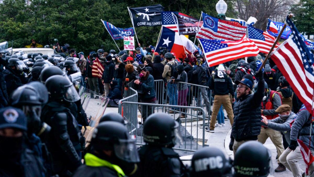 In this Jan. 6, 2021, file photo insurrections loyal to President Donald Trump confront U.S. Capitol Police officers outside the Capitol in Washington. — AP file