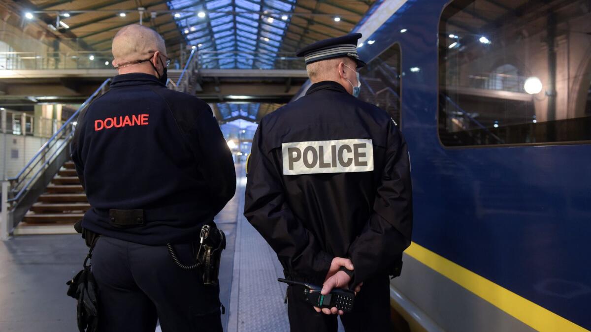 File. A French Border Police officer (L) and a National Police officer stand near an Eurostar train in Gare du Nord station in Paris. Photo: AFP