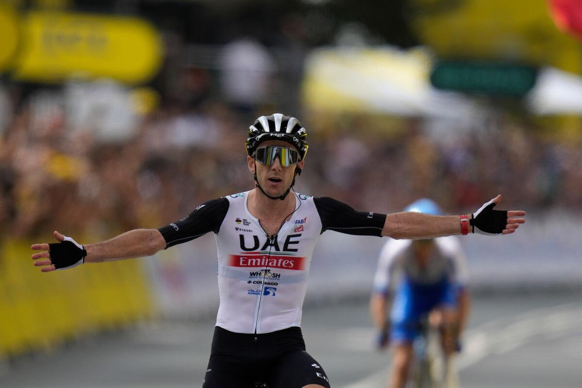 UAE Team Emirates rider Adam Yates celebrates after crossing the finish line of the first stage of the Tour de France in Bilbao, Spain, on Saturday. — AP