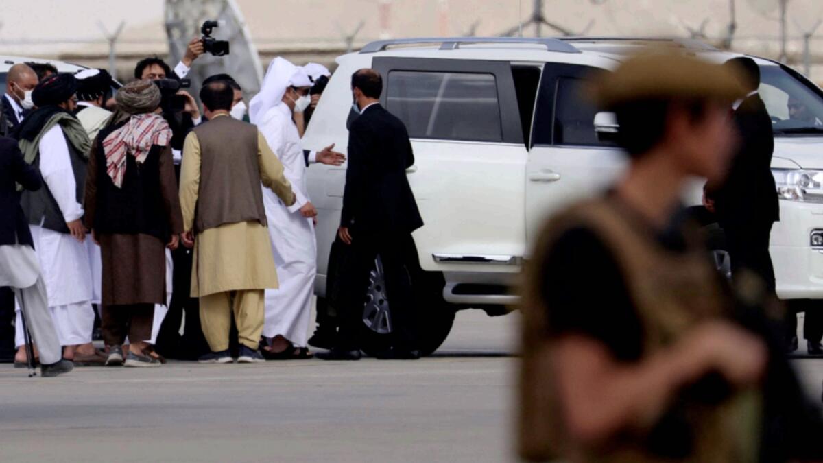 Qatari Deputy Prime Minister and Foreign Minister Mohammed bin Abdulrahman Al Thani boards on a car upon his arrival at the airport in Kabul. — AFP