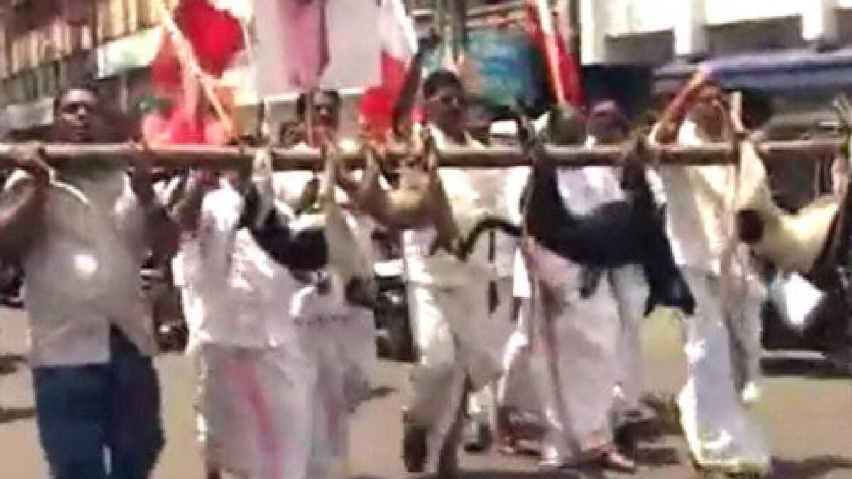 Kerala politicians beat dogs to death, parade them on a pole