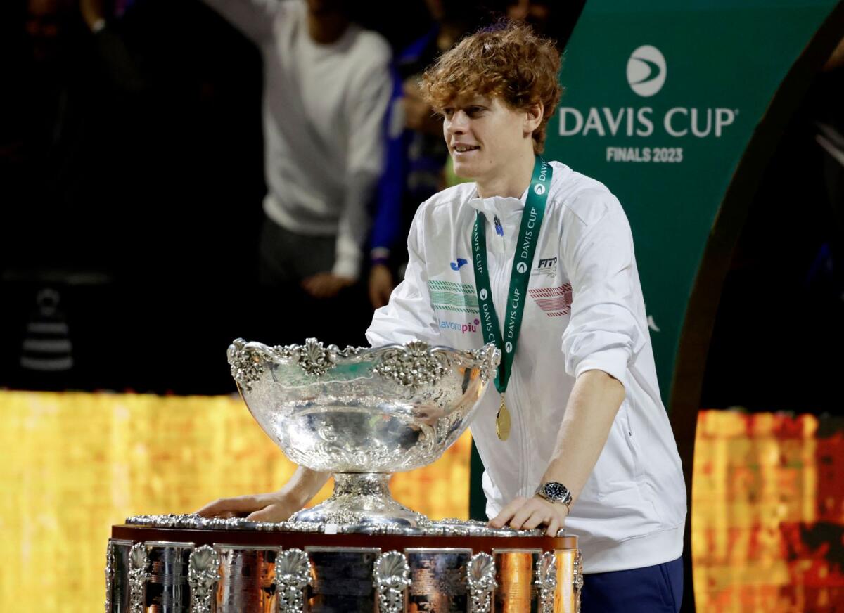 Italy's Jannik Sinner celebrates with the trophy after winning the Davis Cup. — Reuters