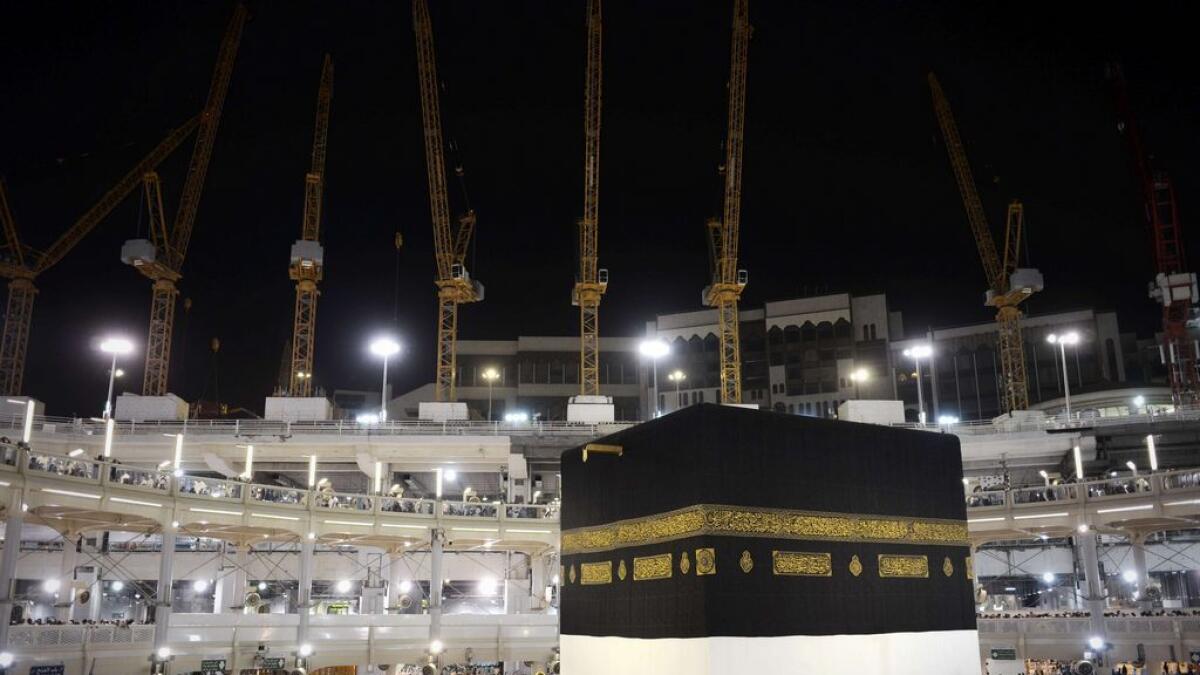 Pilgrims circle counterclockwise holiest shrine, the Kaaba, at the Grand Mosque in the Saudi holy city of Makkah, late on September 20, 2015. 