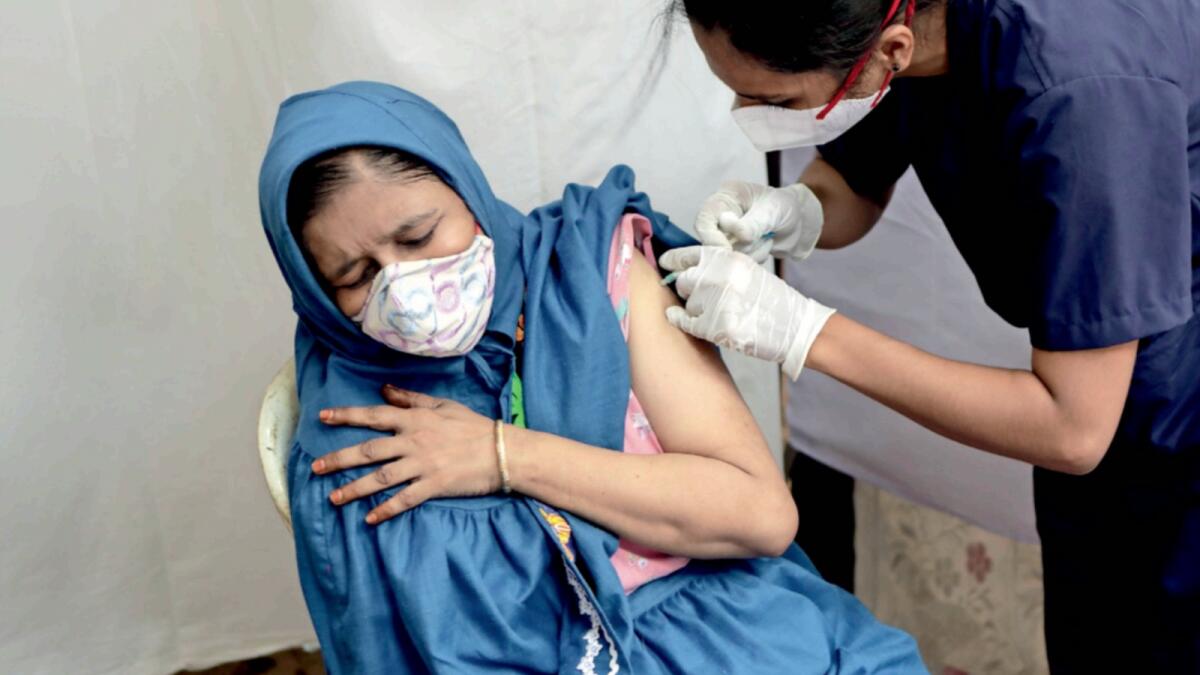 A woman receives Covid-19 vaccine in Mumbai. — AP
