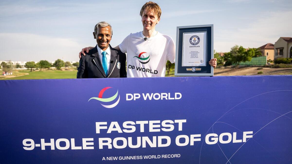 Luke Willett (right), with an Official of the Guinness World of Records after completing his record nine-hole feat at Jumeirah Golf Estates. - Supplied photo