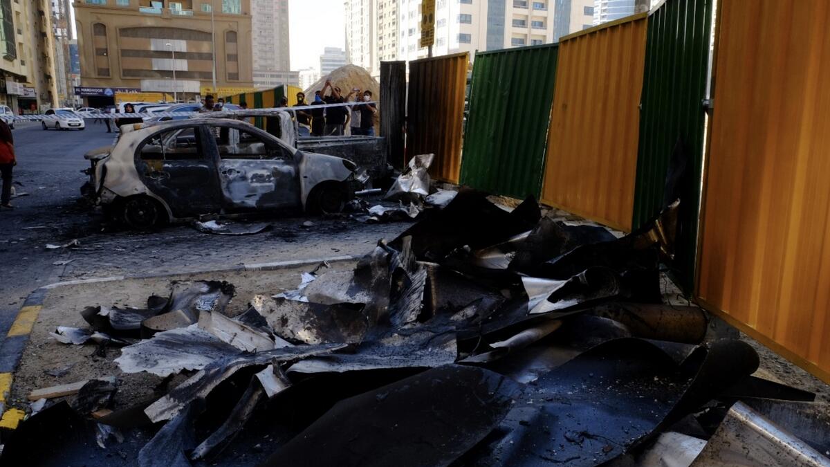 Gutted cars and debris pictured at the site of the Abbco building fire in Al Nahda, Sharjah.