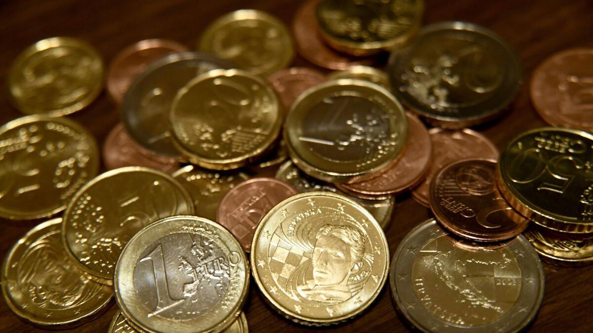 A photograph shows euro coins in Zagreb on December 30, 2022.  On January 1, 2023 the Euro will become the official currency in Croatia.  — AFP