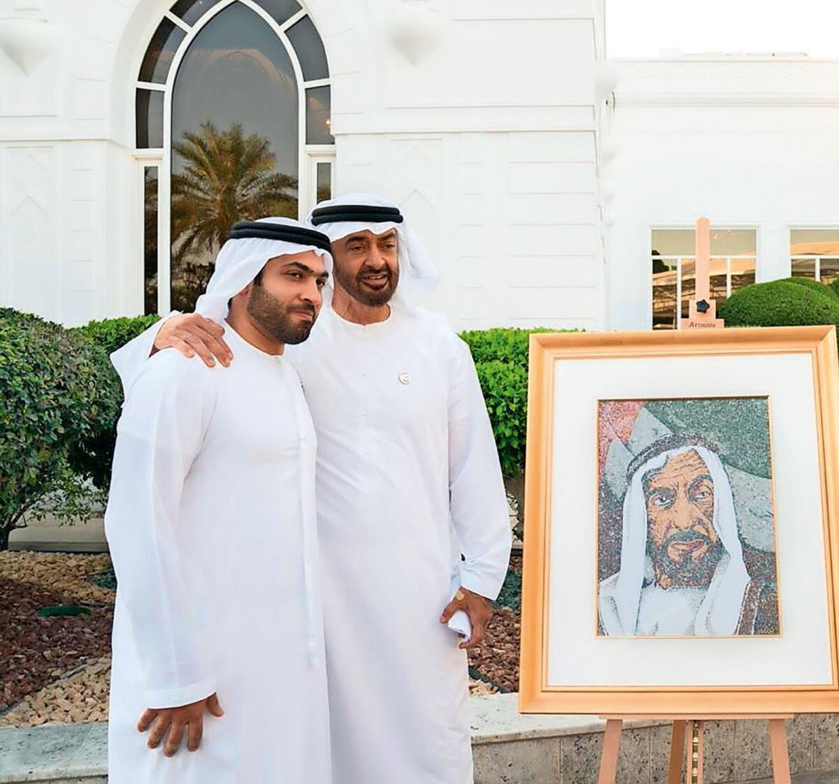 President Sheikh Mohamed bin Zayed Al Nahyan and Mohammed Abdullatif Galadari, Group Chief Executive Officer and Co-Chairman of Galadari Brothers, with Dh1 million portrait of the late Sheikh Zayed bin Sultan Al Nahyan.
