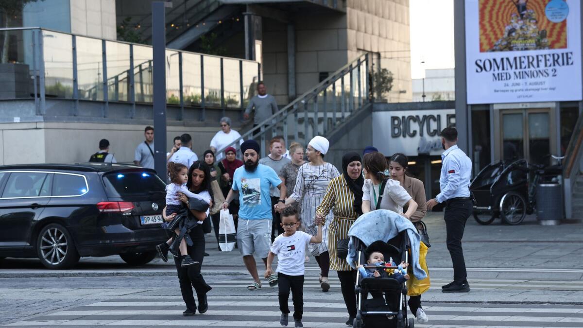 People leave Field's shopping centre, after Danish police said they received reports of shooting, in Copenhagen, Denmark, July 3, 2022. Photo: Reuters
