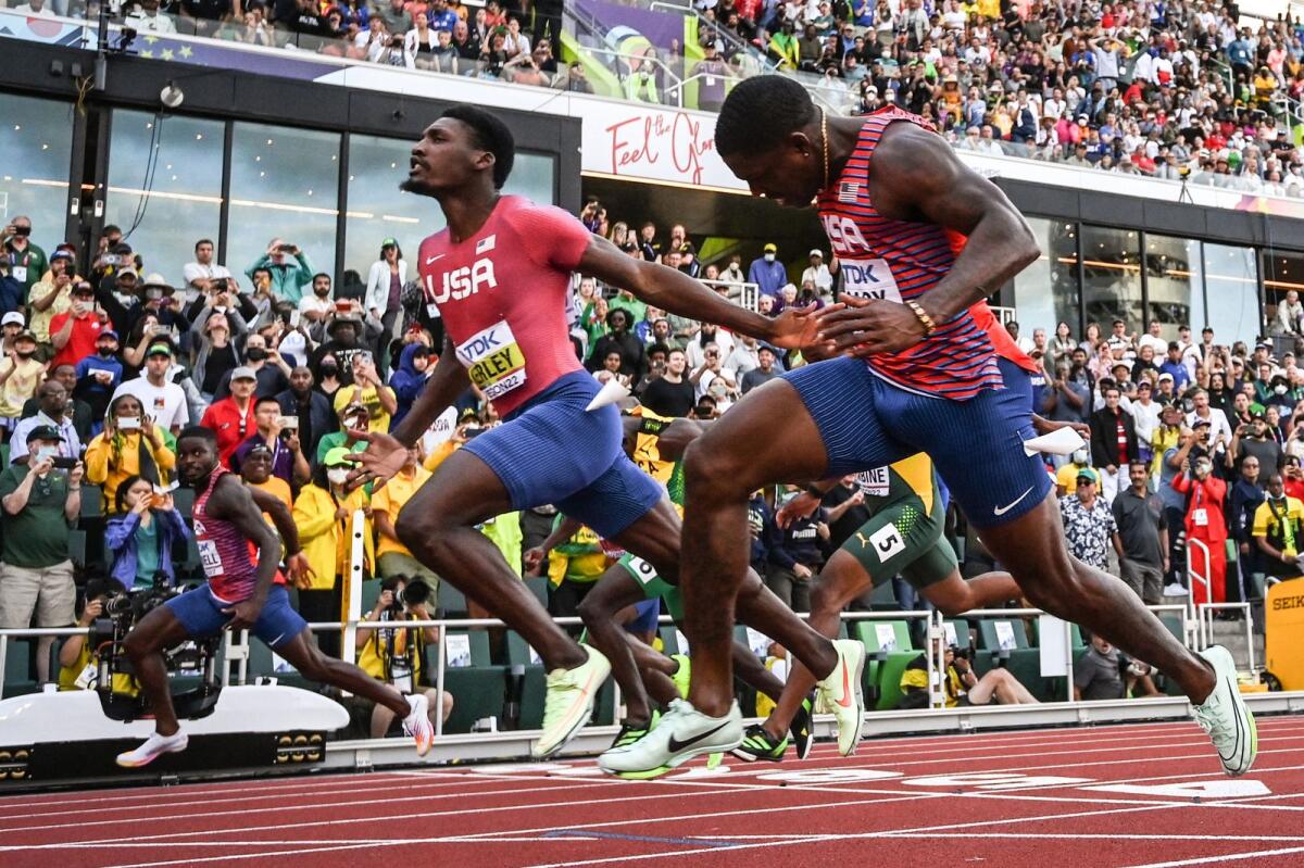 USA's Fred Kerley (centre) crosses the finish line ahead of compatriots Trayvon Bromell (left) and Marvin Bracy. (AFP)