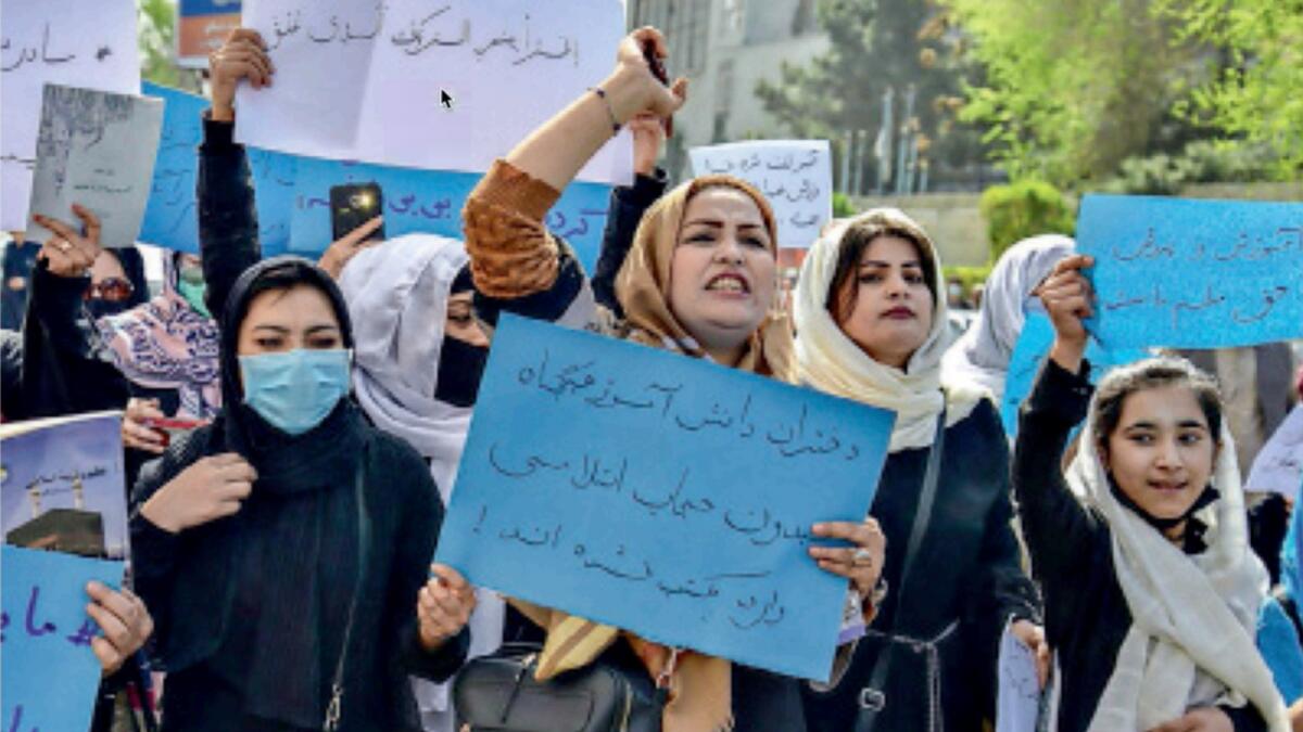 Afghan women and girls take part in a protest in front of the Ministry of Education in Kabul. — AFP file