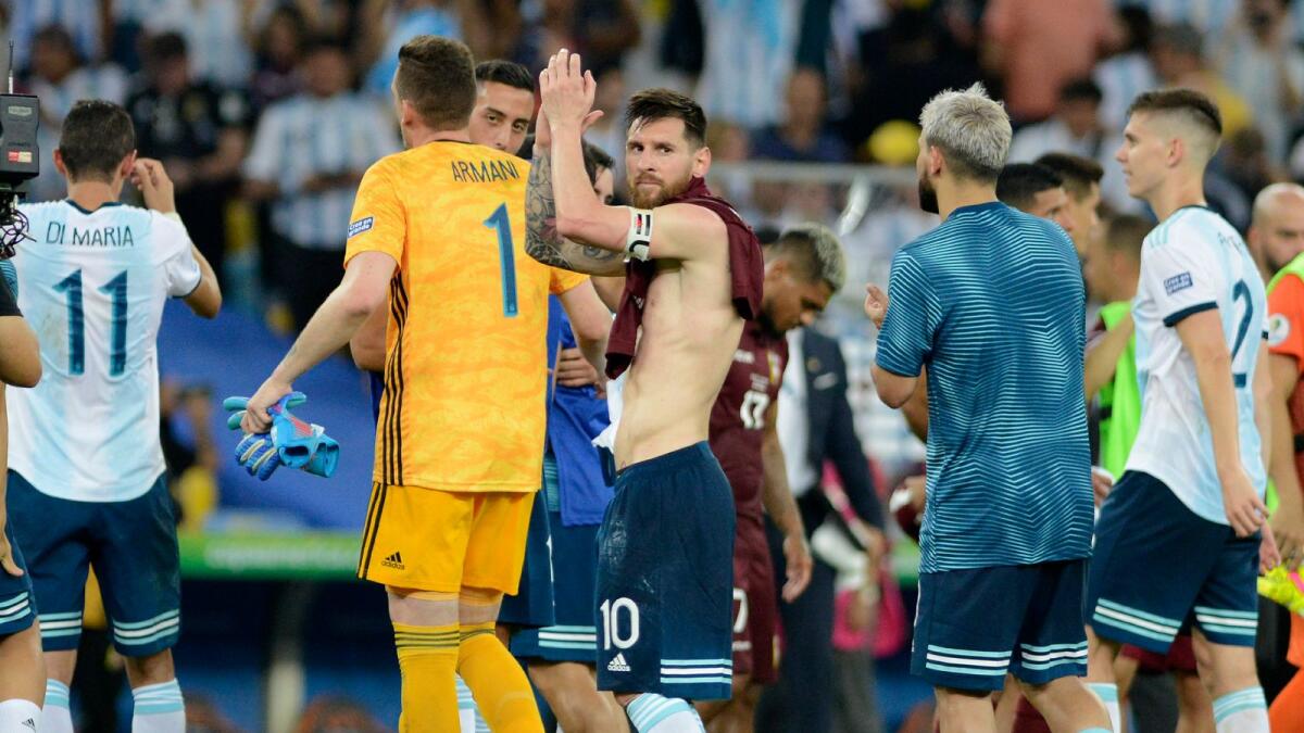Argentina's Lionel Messi acknowledges to fans at the end of a Copa America quarterfinal soccer match against Venezuela. — AP