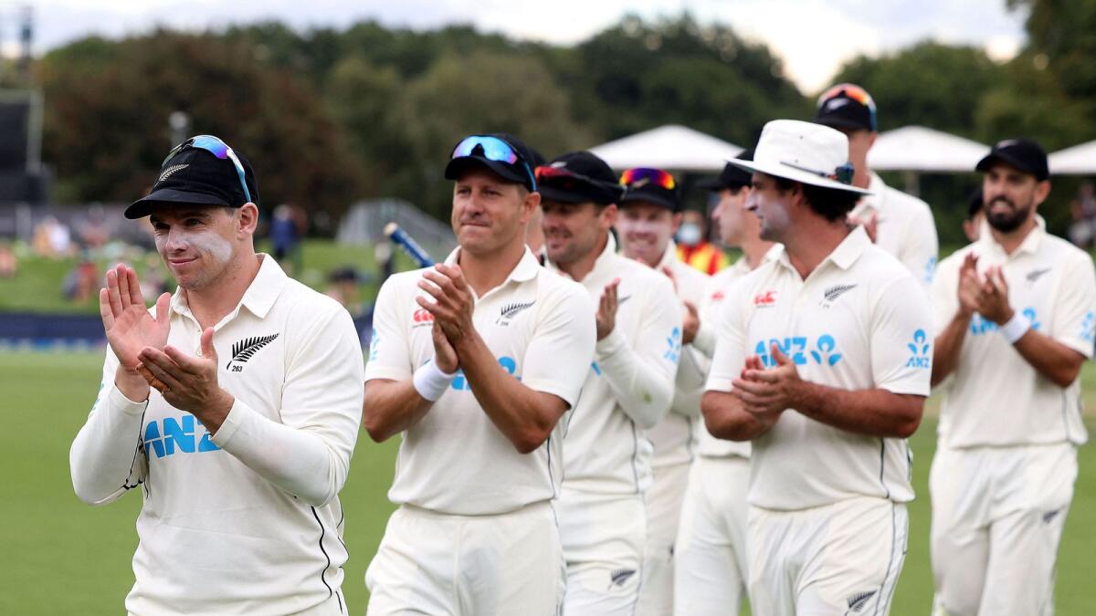 New Zealand captain Tom Latham (left) leads his team off the field after the victory in the first Test against South Africa. (AFP)