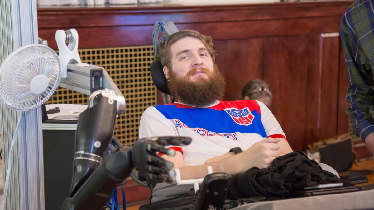 Nathan Copeland 28, who is quadriplegic, controlling a robotic arm, thanks to electrodes implanted in his brain, at the University of Pittsburgh,Pennsylvania.