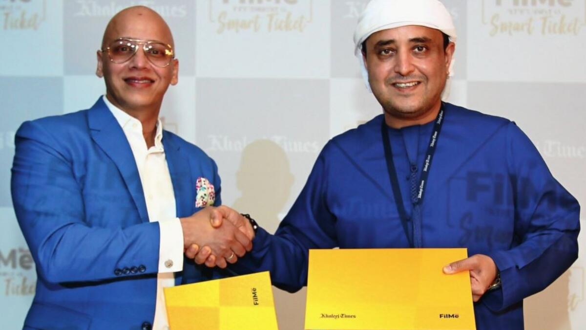 Suhail Galadari, Co-chairman of Galadari Brothers, and Faisal Mushtaq CEO, MeTime Entertainment, exclusive distributor of FilMe in GCC, during the signing ceremony of FilMe’s partnership with Khaleej Times in Dubai on Monday. — Photo by Shihab