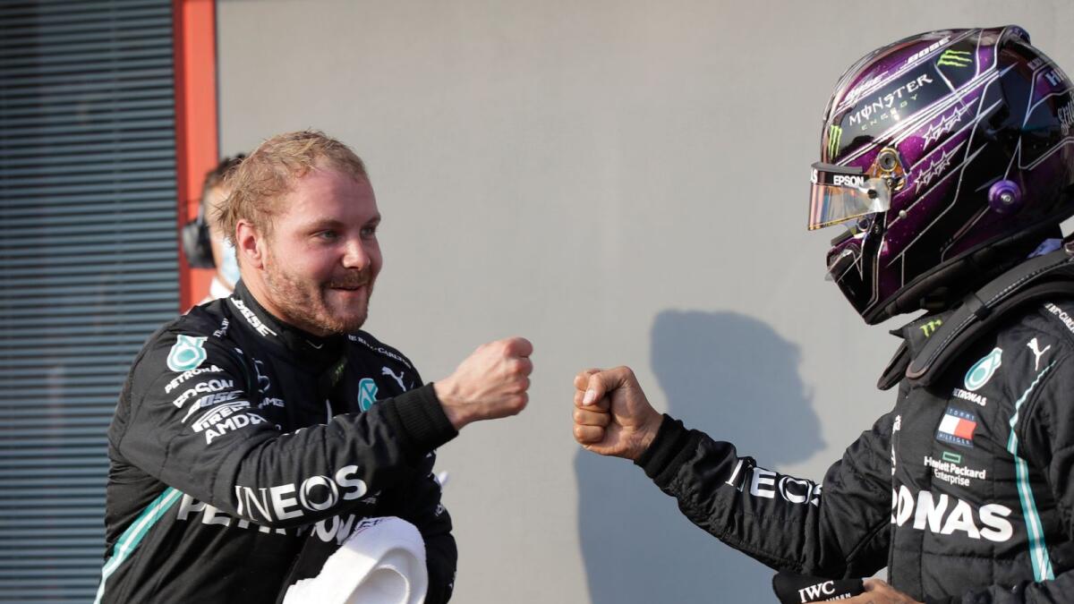Mercedes' Valtteri Bottas celebrates after qualifying in pole position with Lewis Hamilton.— Reuters