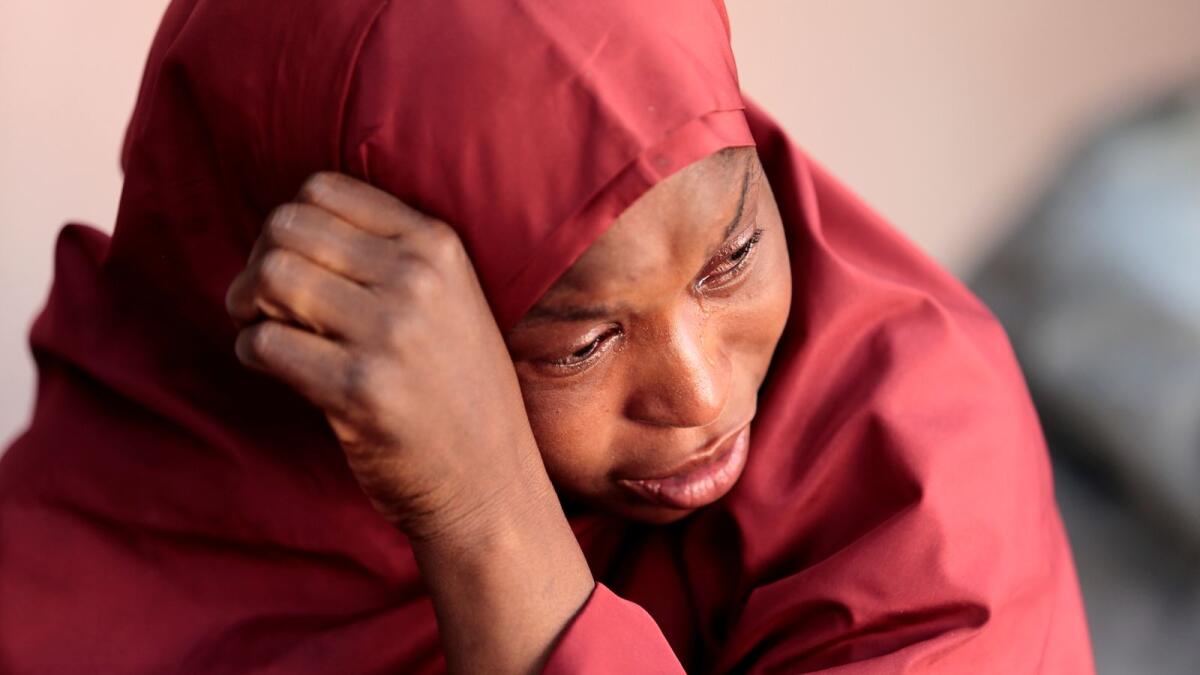 The mother of Muhammad Bello, one the students who was abducted by gunmen, reacts in Kankara.