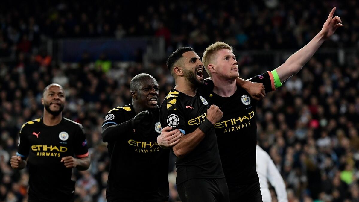 Kevin De Bruyne (right) celebrates his goal with teammates during the UEFA Champions League round of 16 first-leg match against Real Madrid at the Santiago Bernabeu.