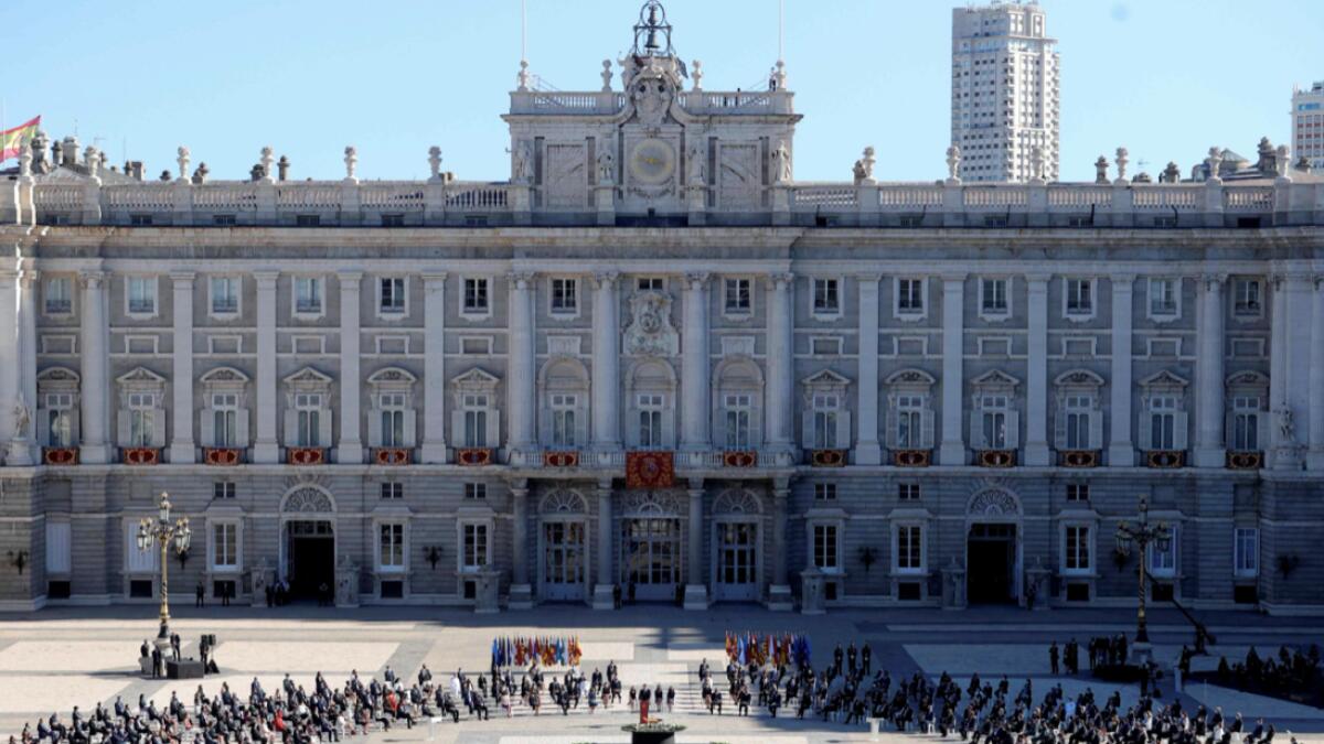 Attendees sit around a cauldron during a state ceremony to honour the 28,400 victims of the coronavirus crisis as well as those public servants who have been fighting on the front line against the pandemic in Spain, at the Royal Palace in Madrid.  Photo: AFP