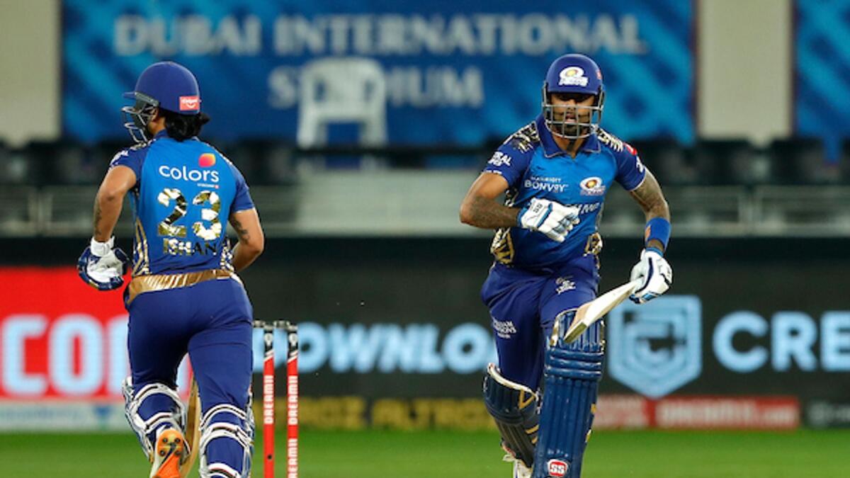 Suryakumar Yadav (right) and Ishan Kishan of Mumbai Indians run between the wickets during their match against the Delhi Capitals in Dubai on Thursday night. — BCCI/IPL