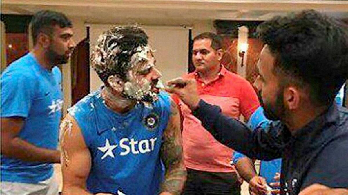 Indian cricket team Captain Virat Kohli celebrate his birthday with team mates at a hotel in Rajkot. -PTI 