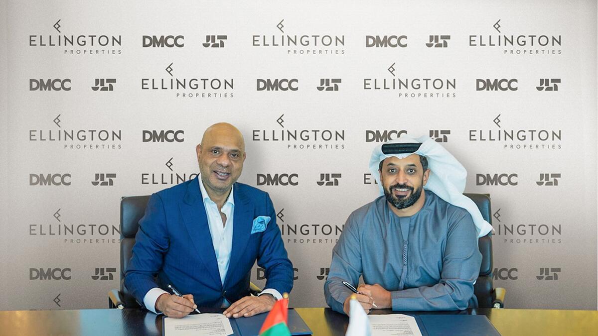Joseph Thomas, co-founder of Ellington Properties, and Ahmed bin Sulayem, executive chairman and chief executive officer of DMCC, signing the agreement. — Supplied photo