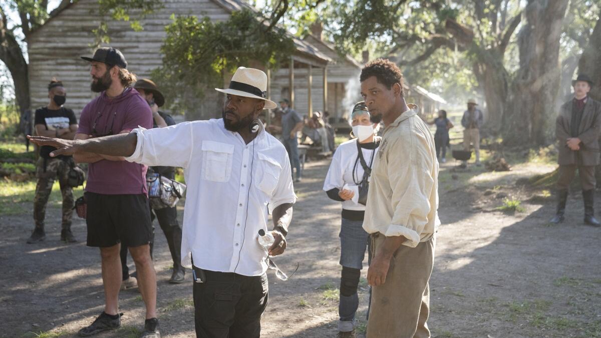 Director Antoine Fuqua and actor Will Smith on the set of 'Emancipation.'