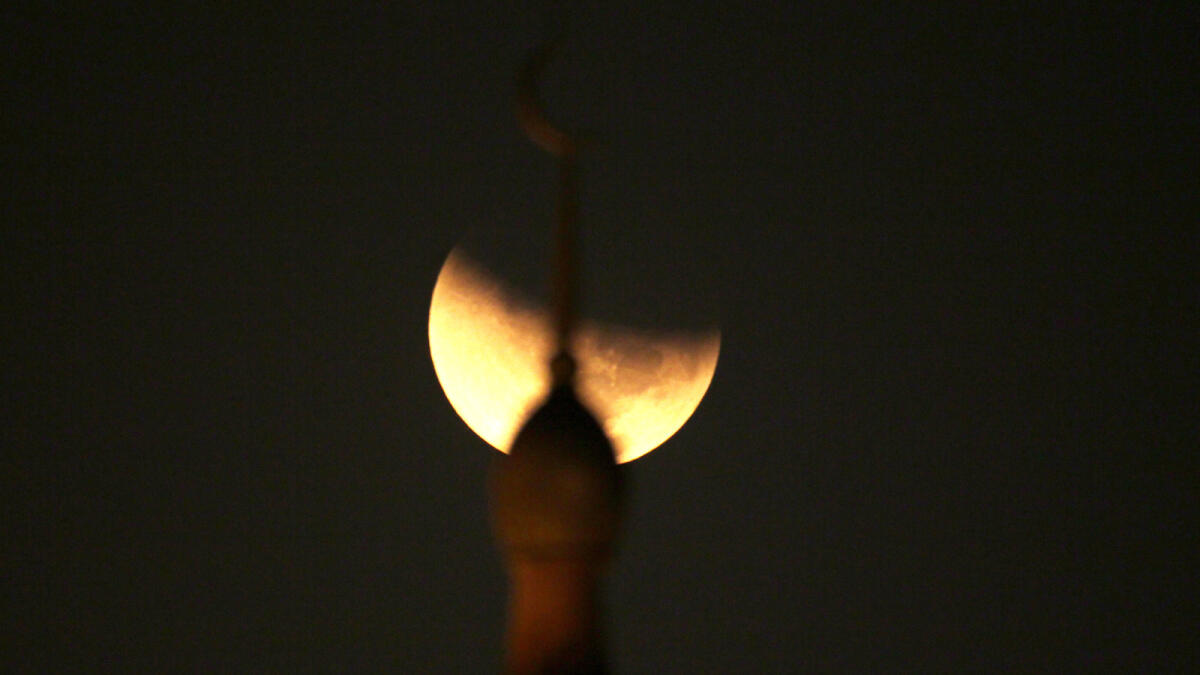 The moon is partially covered by the Earth's shadow during a total lunar eclipse in Dubai. -Photo by Kiran Prasad/Khaleej Times