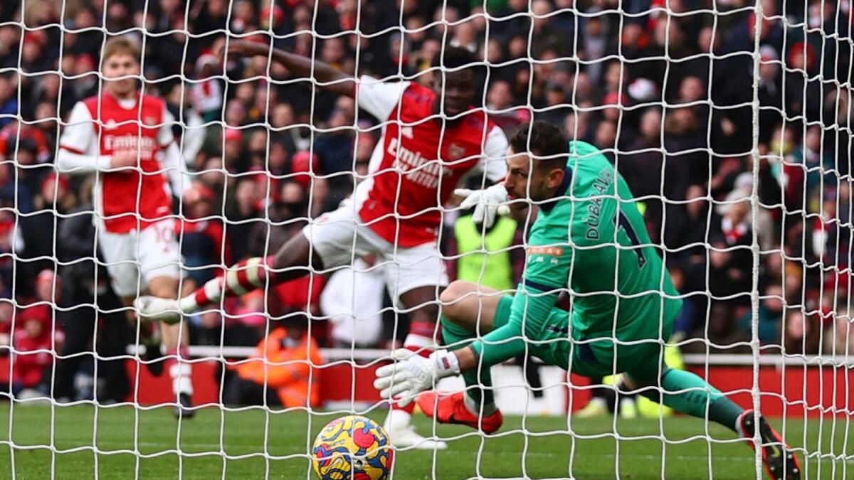 Arsenal's Bukayo Saka (second from right) scores his team's opening goal against Newcastle United. (AFP)