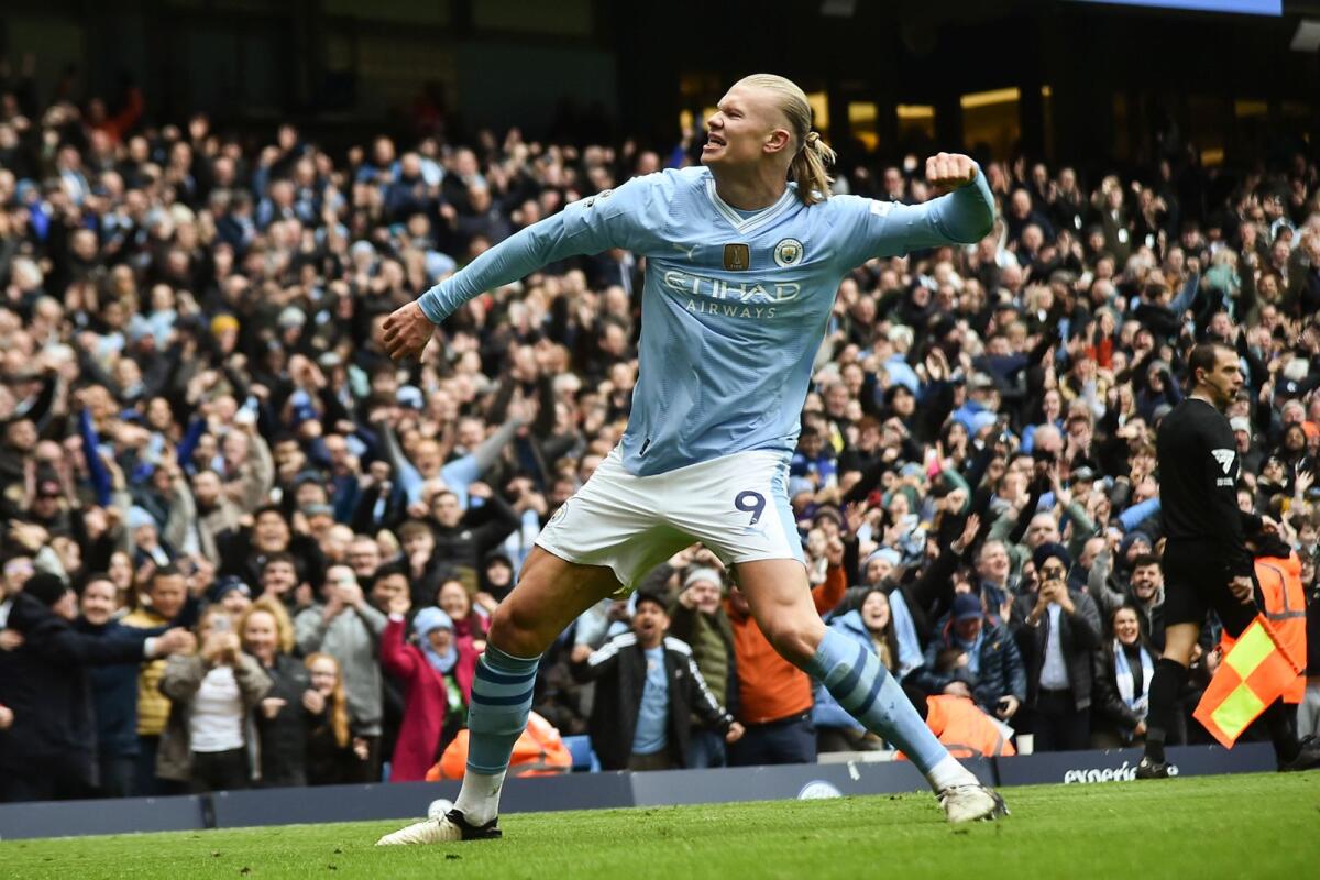 Manchester City's Erling Haaland celebrates with after scoring his side's second goal during the English Premier League soccer match against Everton, at the Etihad stadium in Manchester, England. - AP