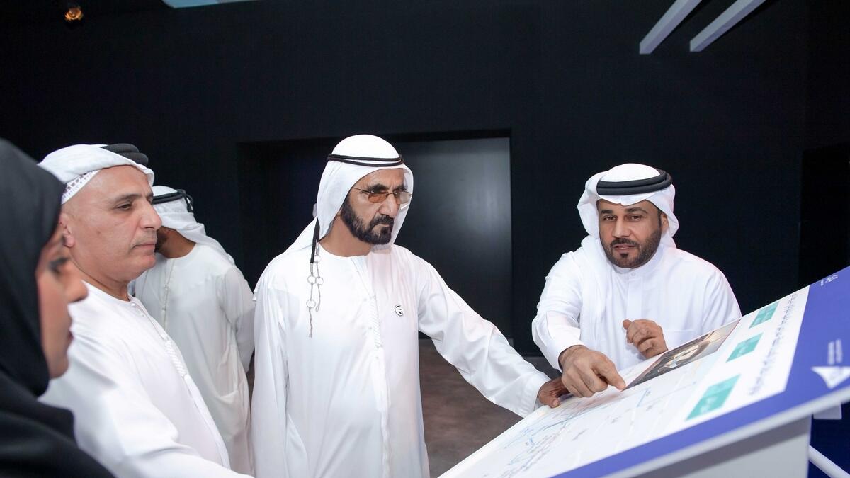 Sheikh Mohammed gets a briefing from RTA officials about one of the future projects of the agency.- Wam
