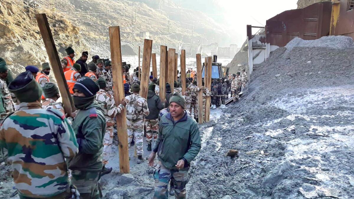 Indo Tibetan Border Police (ITBP) personnel undertake rescue work at one of the hydro power project in Indian state of Uttarakhand. Rescue efforts continue on Monday after part of a glacier broke off, releasing a torrent of water and debris that slammed into two hydroelectric plants on Sunday. — AP