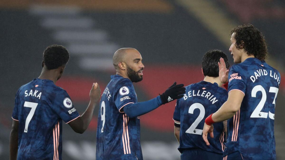 Arsenal's Alexandre Lacazette (second left) celebrates with teammates after scoring his side's third goal. (AP)