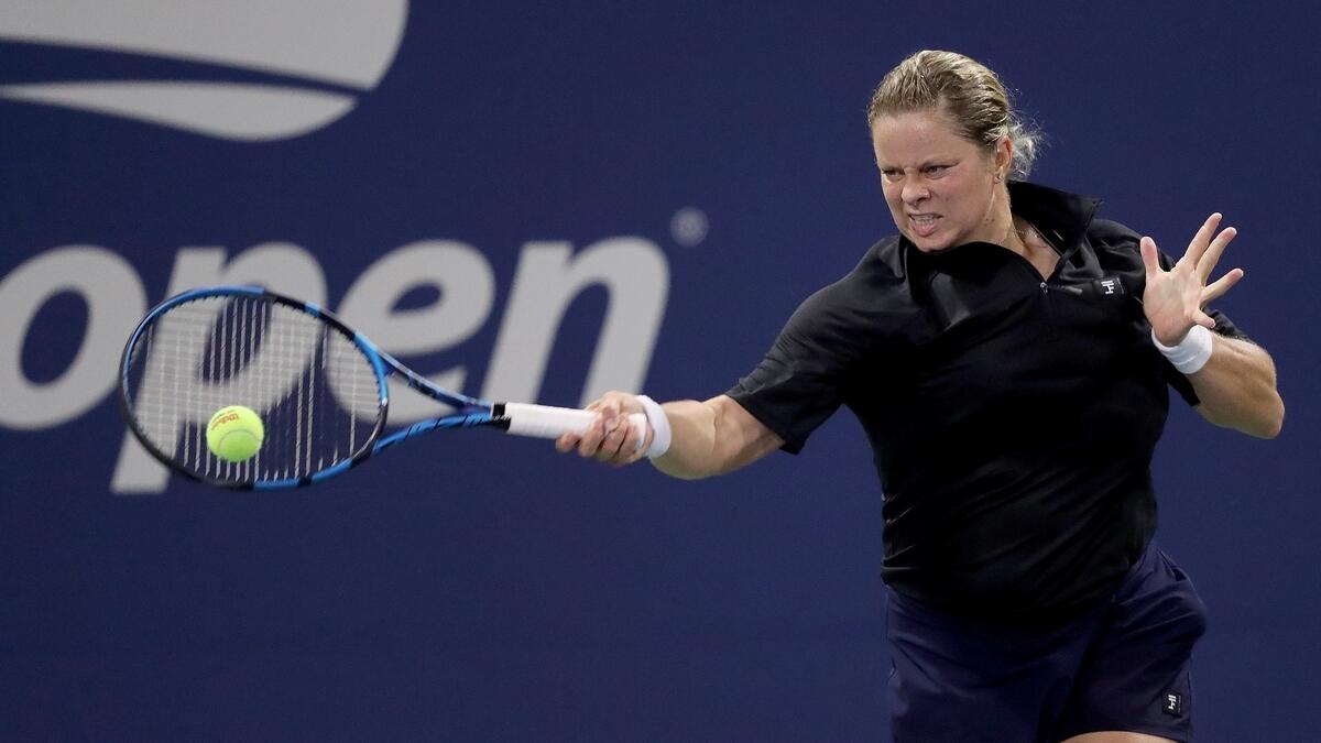 Kim Clijsters hits a forehand return to Ekaterina Alexandrova during his first round defeat. (AFP)